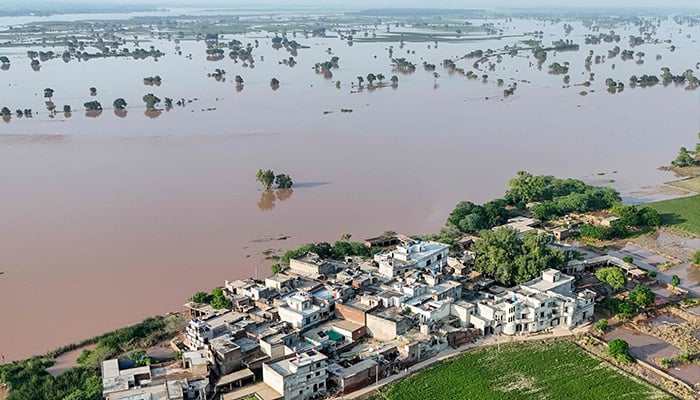 This aerial photograph shows houses submerged with floodwater at Chak Ali Sher village in Wazirabad district on August 28, 2025. — AFP