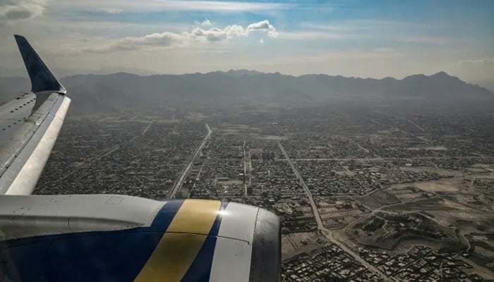 A view from inside a commercial plane flying over Kabul city in November 2021, after the Taliban takeover in August of that year. — AFP