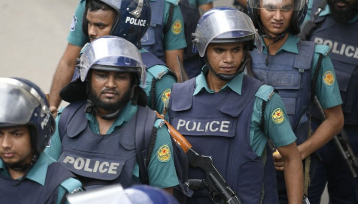 Bangladeshi police members stand guard in front of the Baitul Mukarram mosque during Friday prayer in Dhaka, Bangladesh, June 16, 2023. — Reuters