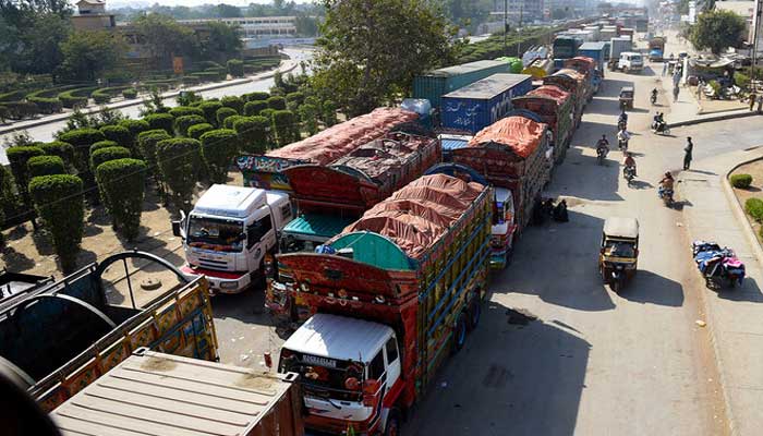Trucks wait on a road in Karachi in this undated image. — AFP/File