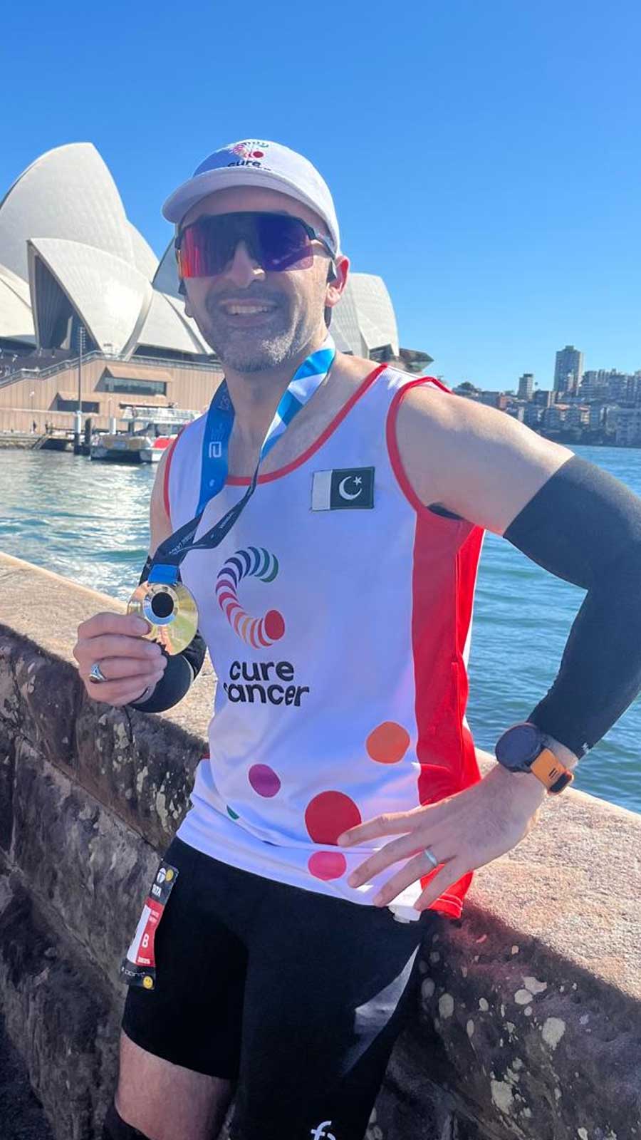 Pakistani runner Ali Zaidi poses with a medal at the Sydney Marathon. — Reporter