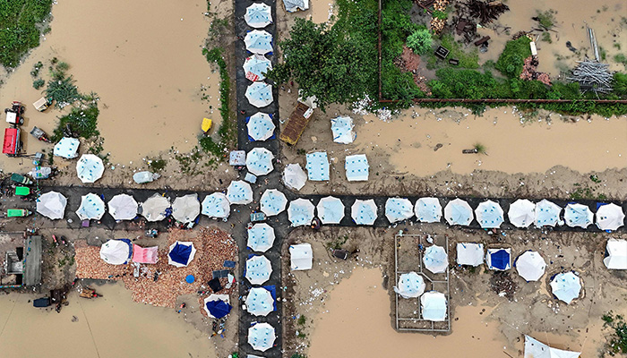 This aerial view shows makeshift shelters built for flood-affected people in Chung, in Punjab province, on August 31, 2025. — AFP