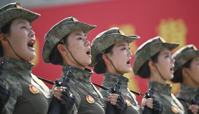 Chinese military personnel take part in a rehearsal ahead of a parade commemorating the 80th anniversary of the victory over Japan, which will be held on September 3 in Beijing. — AFP/File