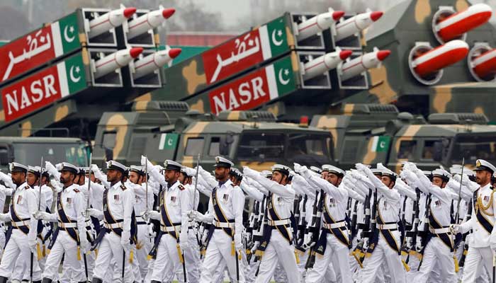 Pakistani Navy soldiers march past the Nasr solid fuelled tactical ballistic missile system during Pakistan Day military parade in Islamabad