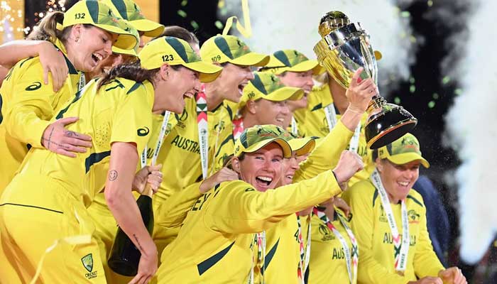 Australian players celebrate with trophy after winning the Womens World Cup. — ICC website