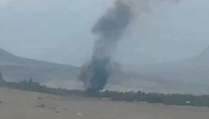 Smoke rising from crashed helicopter seen in this still taken from video. — Geo News