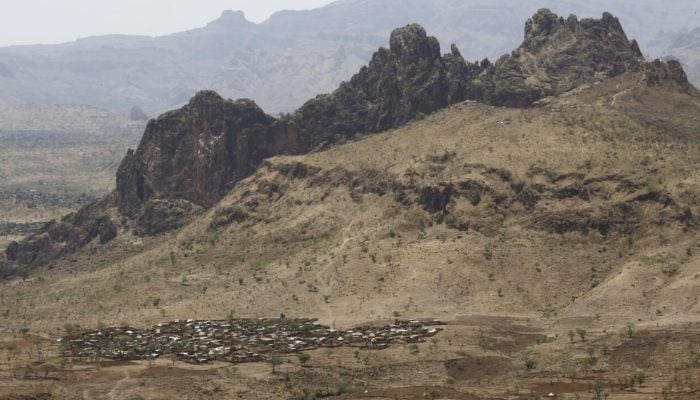 A picture taken from a helicopter on June 19, 2017 shows an aerial view of the war-torn town of Golo in the thickly forested mountainous area of Jebel Marra in central Darfur, Sudan. — AFP