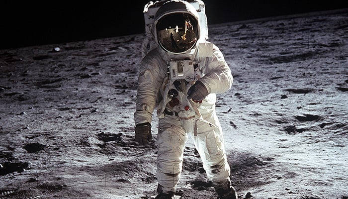 This art illustration shows an astronaut standing on moon. — Pexels
