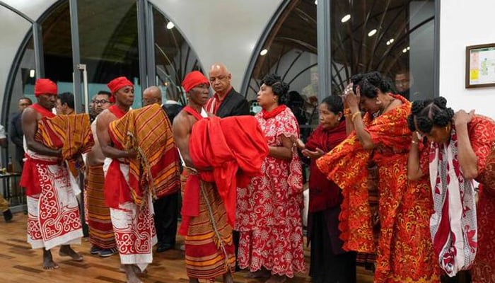 Men carry the three Sakalava skulls as descendants of the Sakalava King Toera bow during a welcome ceremony for their restitution to Madagascar from France at the Ivato International Airport in Antananarivo on September 1, 2025. — AFP