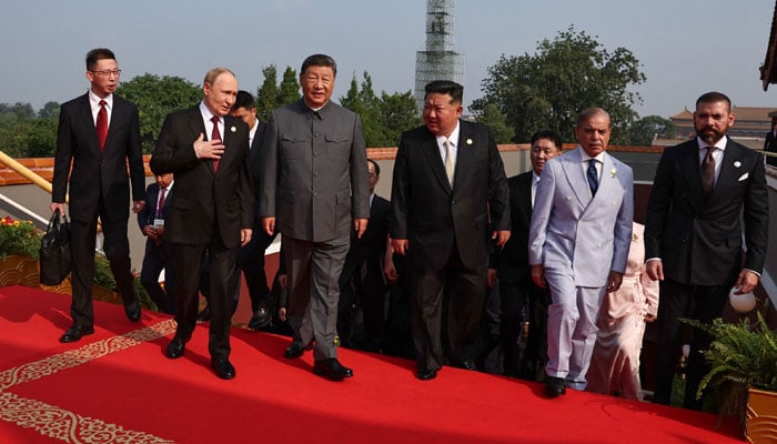 PM Shehbaz Sharif (second left) pictured with Chinese President Xi Jinping and Russias Valadimir Putin (second right)Russia´s President Vladimir Putin walks with China´s President Xi Jinping (third right),duringmilitary parade in Beijings Tiananmen Square on September 3, 2025. — AFP