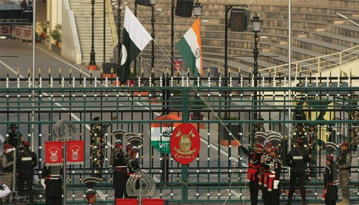 Pakistani and Indian border guards pictured during a flag-lowering ceremony at the Wagah Border Crossing. — Reuters/File
