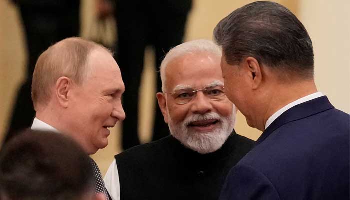 Indian Prime Minister Narendra Modi talks with Russian President Vladimir Putin and Chinese President Xi Jinping ahead of the Shanghai Cooperation Organization (SCO) Summit 2025 at the Meijiang Convention and Exhibition Centre in Tianjin, China, September 1, 2025. — Reuters