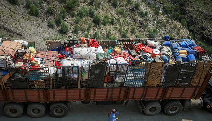 A man walks past a truck loaded with belongings of Afghan nationals, as they head back to Afghanistan after Pakistan started to deport documented Afghan refugees, near Torkham border crossing between Pakistan and Afghanistan, September 1, 2025. — Reuters
