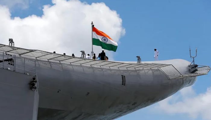 Indian navy officers stand on the flight deck of Indias first home-built aircraft carrier, the INS Vikrant, after its commissioning ceremony at a state-run shipyard in Kochi, India, on September 2, 2022. — Reuters