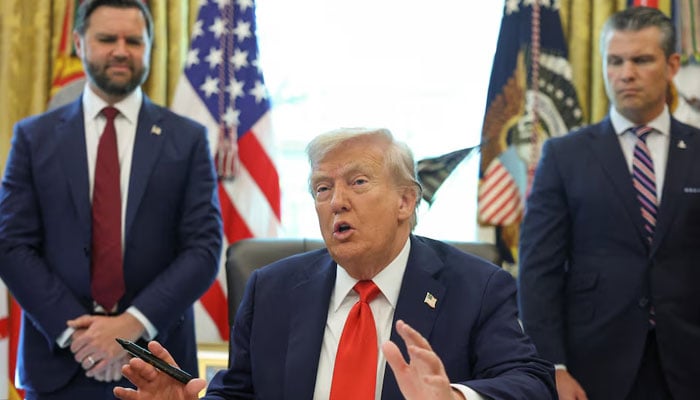 US President Donald Trump speaks after signing an executive order, as US Vice President JD Vance and US Defense Secretary Pete Hegseth look on, in the Oval Office at the White House in Washington, D.C., US, August 25, 2025. — Reuters