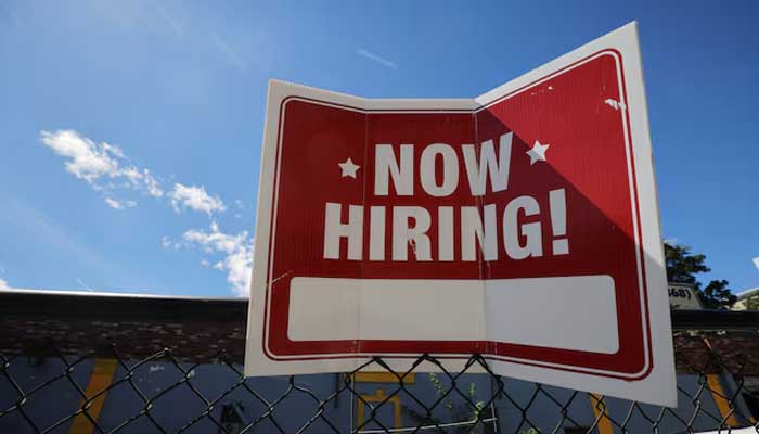 A now hiring sign is displayed outside Taylor Party and Equipment Rentals in Somerville, Massachusetts, US, September 1, 2022. — Reuters