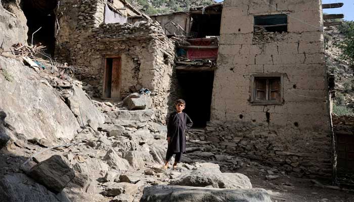 A boy stands in front of houses damaged by a deadly earthquake that struck Afghanistans Kunar and Nangarhar provinces, at Masud village in Nurgal district, Kunar province, Afghanistan, September 4, 2025. — Reuter