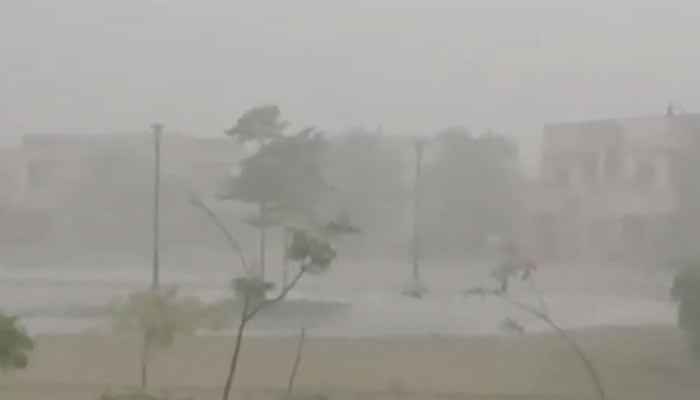 This photo shows heavy rain hitting a private housing society near the M9 Motorway in Karachi on September 7, 2025. — X/@FayzanAbro/screengrab