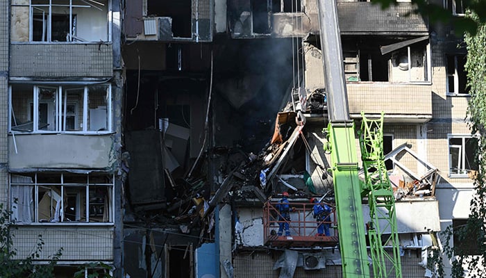 Firefighters work at a site of a heavily damaged residential building following Russian drone and missile strikes in Kyiv on September 7, 2025, amid the Russian invasion of Ukraine. — AFP