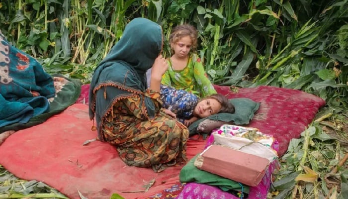 Afghan children sit with their belongings in a field, after a deadly magnitude-6 earthquake that struck Afghanistan, in Kunar province, Afghanistan, September 2, 2025. — Reuters