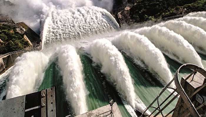 A representational image showing water flowing from opened spillways of a dam. — Radio Pakistan/File