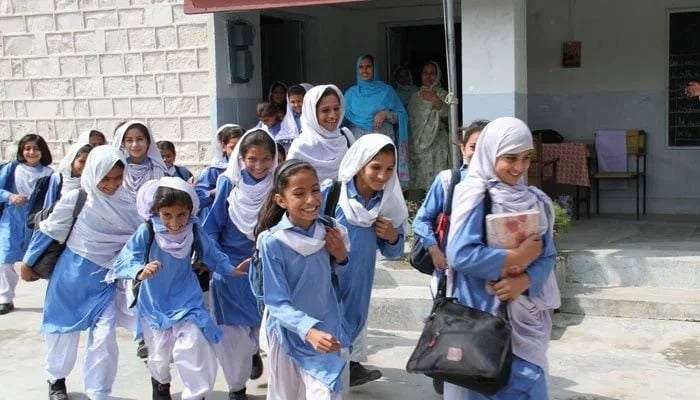 Schoolgirls rush towards their classes in an undated picture. — Online/file