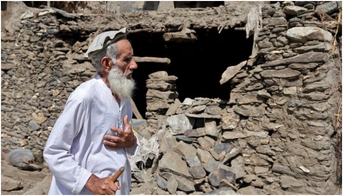 An old farmer, walks past a damaged house following a deadly earthquake that struck Afghanistans Kunar and Nangarhar provinces, at Masud village in Nurgal district, Kunar province, Afghanistan, September 4, 2025. — Reuters