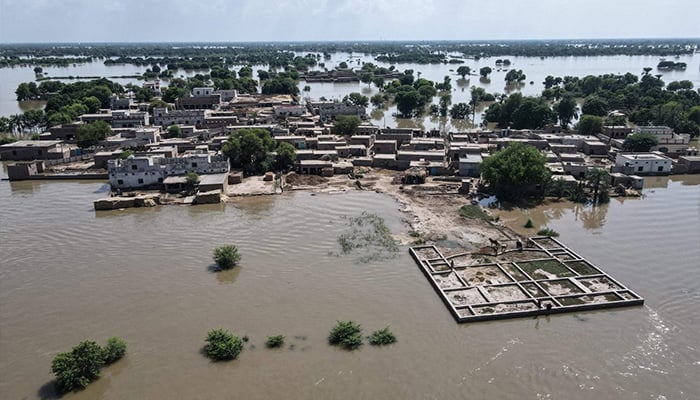 An aerial view shows partially submerged residential houses in Jalalpur Pirwala, in the Multan district of Punjab on September 9, 2025, after the Chenab River overflowed following heavy monsoon rains. — AFP