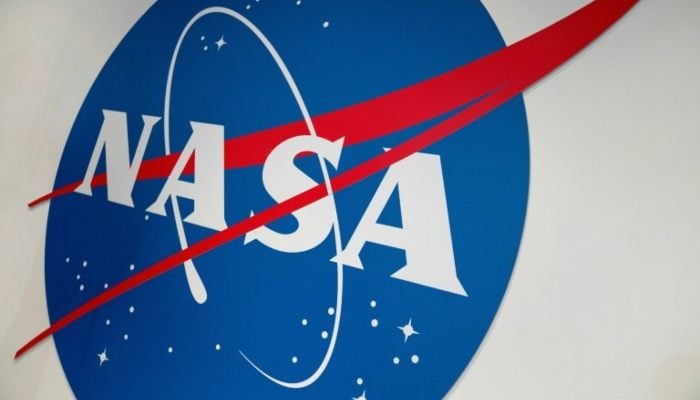 The NASA logo is displayed at the Earth Information Center exhibit, at NASA headquarters in Washington, DC, on June 21, 2023. — AFP