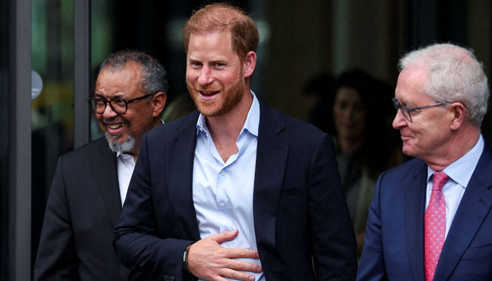 Prince Harry seems upbeat after his private tea with King Charles