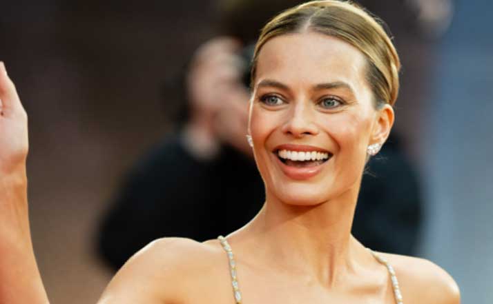 Margot Robbie honors Armani legacy with daring dress days after designers funeral