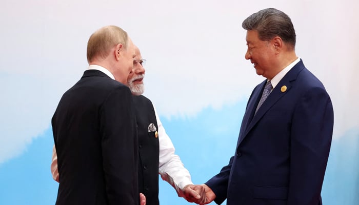 Chinese President Xi Jinping, Indian Prime Minister Narendra Modi and Russian President Vladimir Putin speak during a meeting at the Shanghai Cooperation Organisation (SCO) summit in Tianjin, China, September 1, 2025. — Reuters
