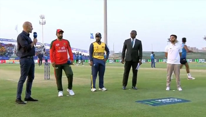 Bangladesh captain Litton Das (second from right) and Sri Lanka skipper Charith Asalanka (second from left) at the toss for their Asia Cup 2025 match at Sheikh Zayed Cricket Stadium, Abu Dhabi, September 13, 2025. — Livestream/screengrab