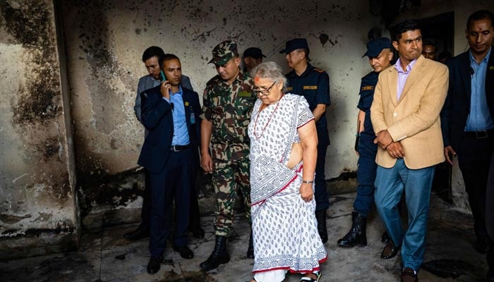Nepals interim leader Sushila Karki is inspecting a torched police station. — AFP