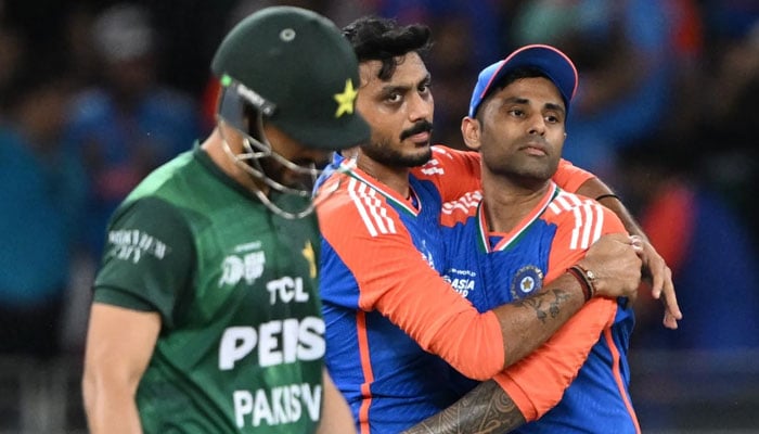 India skipper Suryakumar Yadav celebrates with Axar Patel after Pakistan skipper Salman Ali Agha fall during their Asia Cup clash at Dubai International Cricket Stadium, Dubai, September 14, 2025. — AFP