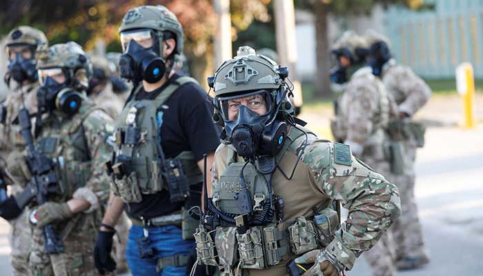 US ICE officers stand outside an ICE facility in Broadview, Illinois on September 12, 2025. — Reuters