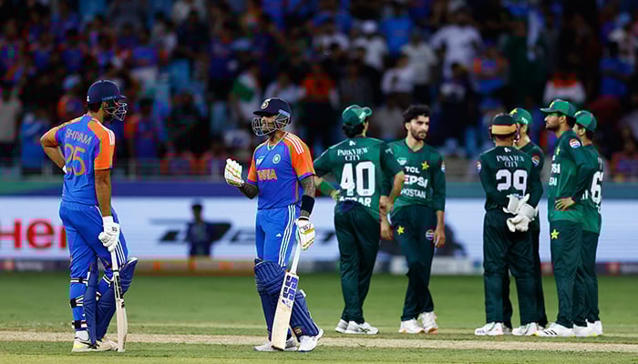 Indias Suryakumar Yadav talks to Shivam Dube during the Asia Cup 2025 match against Pakistan at Dubai International Cricket Stadium, Dubai, UAE, on September 14, 2025. — Reuters