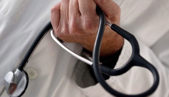 A photo illustration shows a French general practitioner holding a stethoscope in a doctors office in Bordeaux January 7, 2015. — Reuters
