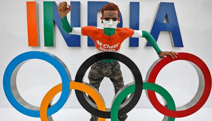 Arun Haryani, 38, a fan, poses with the Olympic rings as he cheers on Indias team for the Tokyo 2020 Olympics, in Ahmedabad, India, July 22, 2021.— Reuters