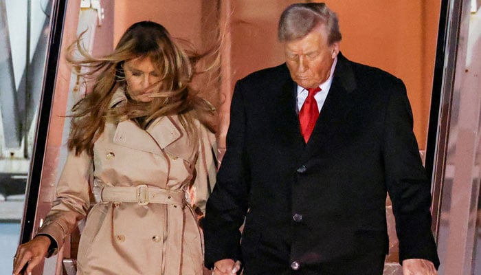 US president Donald Trump and first lady Melania Trump disembark Air Force One as they arrive for their state visit to Britain, at London Stansted Airport near London, Britain, September 16, 2025. REUTERS