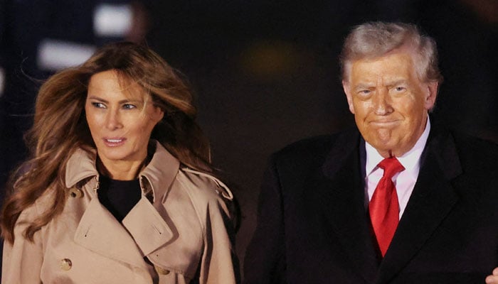 U.S. President Donald Trump and first lady Melania Trump are greeted by Viscount Henry Hood, representing Britains King Charles, as they arrive for their state visit to Britain, at London Stansted Airport near London, Britain, September 16, 2025. REUTERS/Chris Radburn TPX IMAGES OF THE DAY