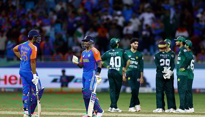 Indias Suryakumar Yadav talks to Shivam Dube during Asia Cup 2025 clash at Dubai International Cricket Stadium, Dubai, UAE, September 14, 2025. — Reuters