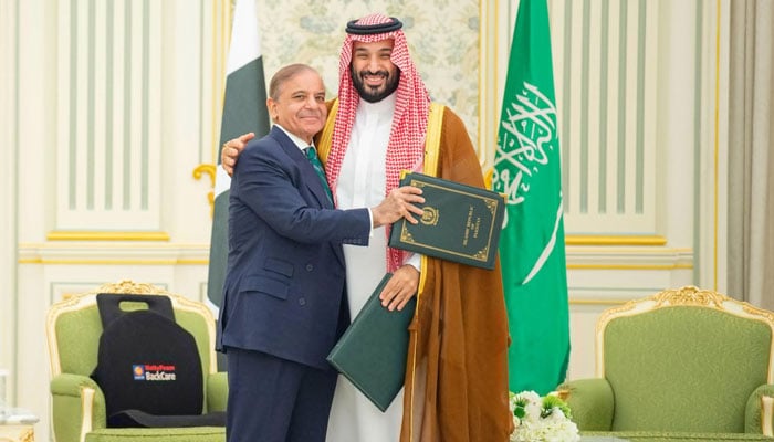 Prime Minister Shehbaz Sharif and Saudi Crown Prince Mohammed bin Salman share a moment after signing the landmark Strategic Mutual Defense Agreement in Riyadh, Saudi Arabia, September 17, 2025. — Prime Ministers House