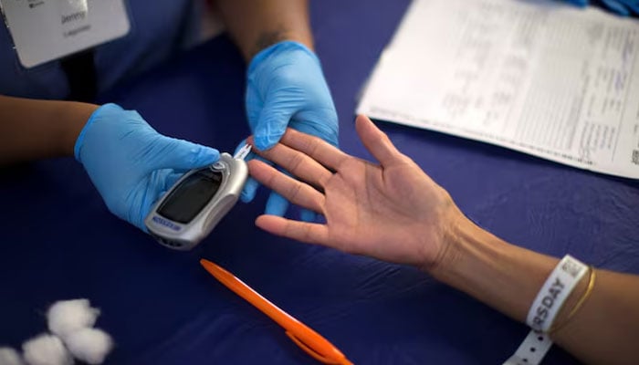 A person receives a test for diabetes during Care Harbor LA free medical clinic in Los Angeles, California September 11, 2014.— Reuters