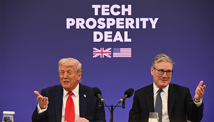 Britains Prime Minister Keir Starmer (R) and US President Donald Trump (L) gesture as they announce a technology prosperity deal at a Business event at Chequers, in Aylesbury, central England, on September 18, 2025, on the second day of the US Presidents second State Visit. — AFP