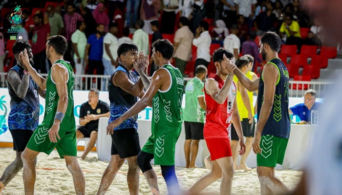 Pakistani and Indian players shake hands after conclusion of match at the Khedhufushi City Beach Handball Court, on September 18, 2025. — Reporter