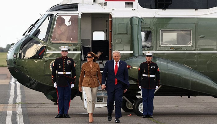 US President Donald Trump and first lady Melania Trump step from the backup Marine One helicopter after the primary Marine One helicopter experienced a mechanical issue after its departure from Chequers, at London Standsted Airport in Britain, September 18, 2025. — Reuters