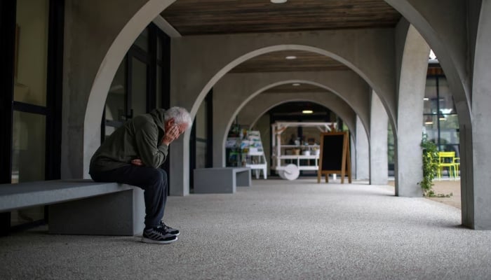 An Alzheimers patient rests on a bench after a walk at the Village Landais Alzheimer site in Dax, France, September 24, 2020. — Reuters