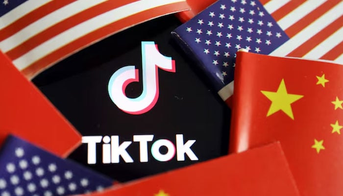 China and US flags are seen near a TikTok logo in this illustration picture taken July 16, 2020.— Reuters