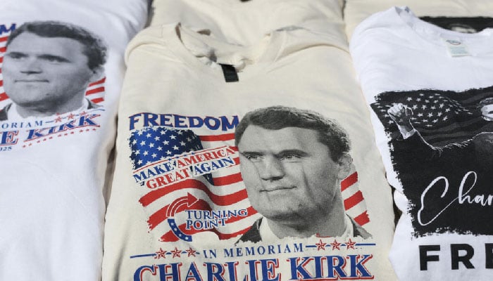 Charlie Kirk tee-shirts are sold near the State Farm Stadium as it prepares to host a memorial service on September 20, 2025, in Glendale, Arizona. — AFP